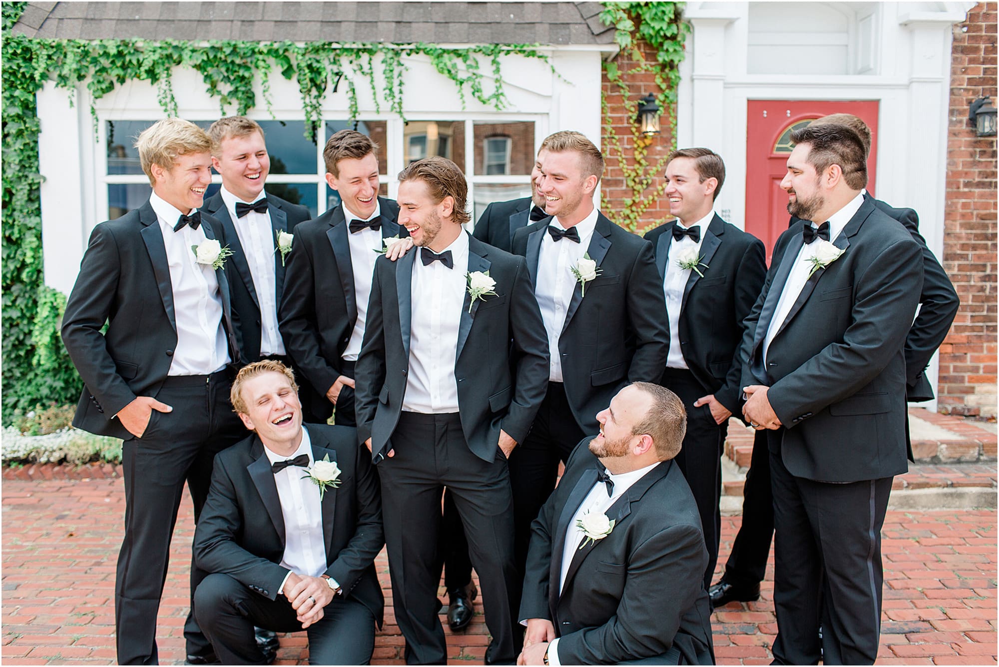 Arielle Peters Photography | Groom and groomsmen next to ivy-covered building on wedding day at the Uptown Center in Michigan City, Indiana.