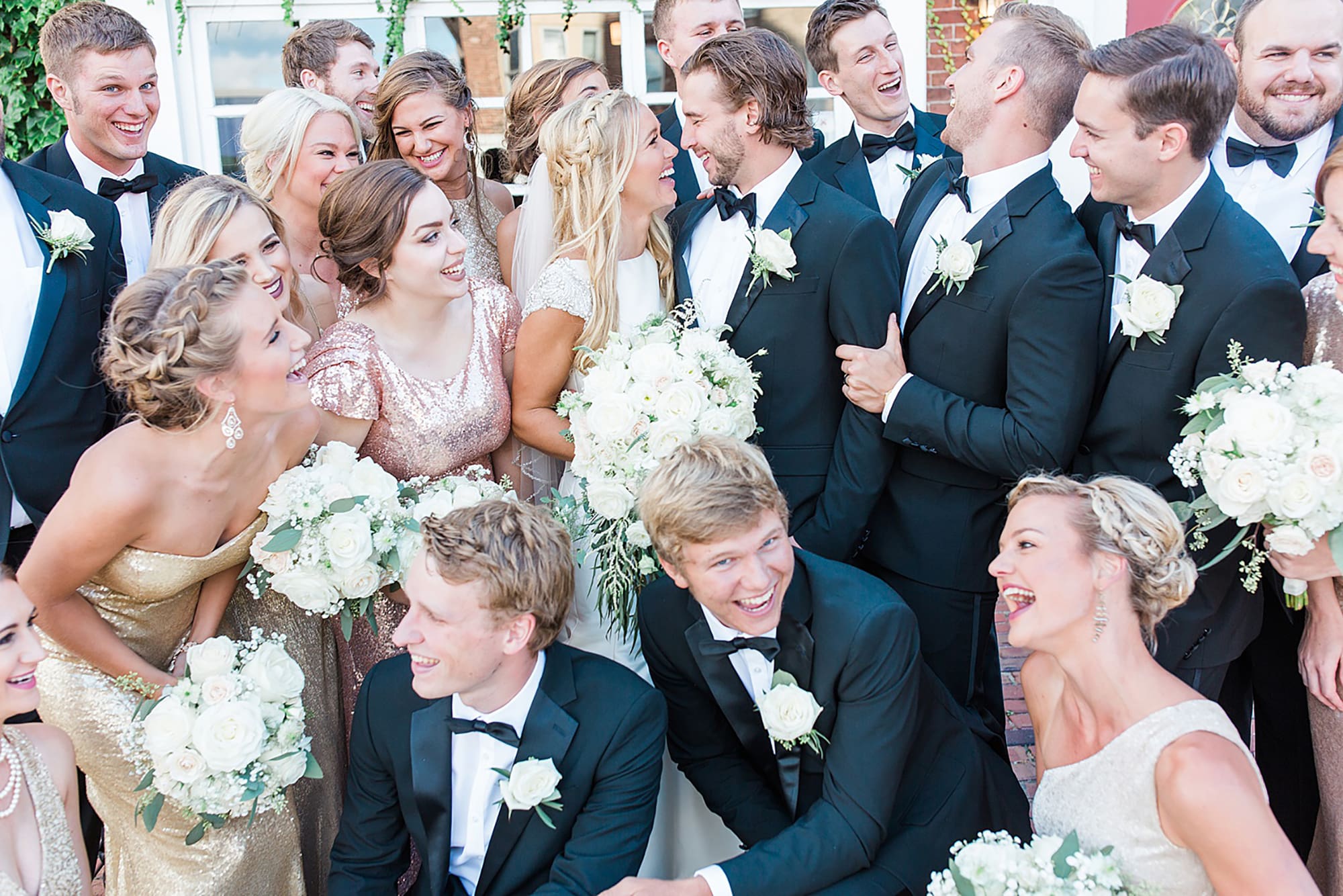 Arielle Peters Photography | Wedding party next to ivy-covered building on wedding day at the Uptown Center in Michigan City, Indiana.