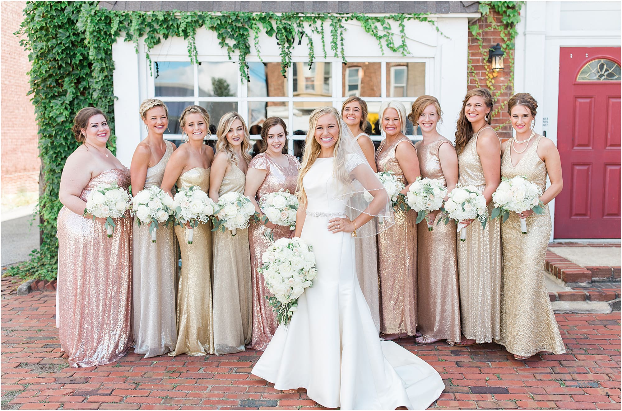 Arielle Peters Photography | Bride and bridesmaids next to ivy-covered windows on wedding day at the Uptown Center in Michigan City, Indiana.