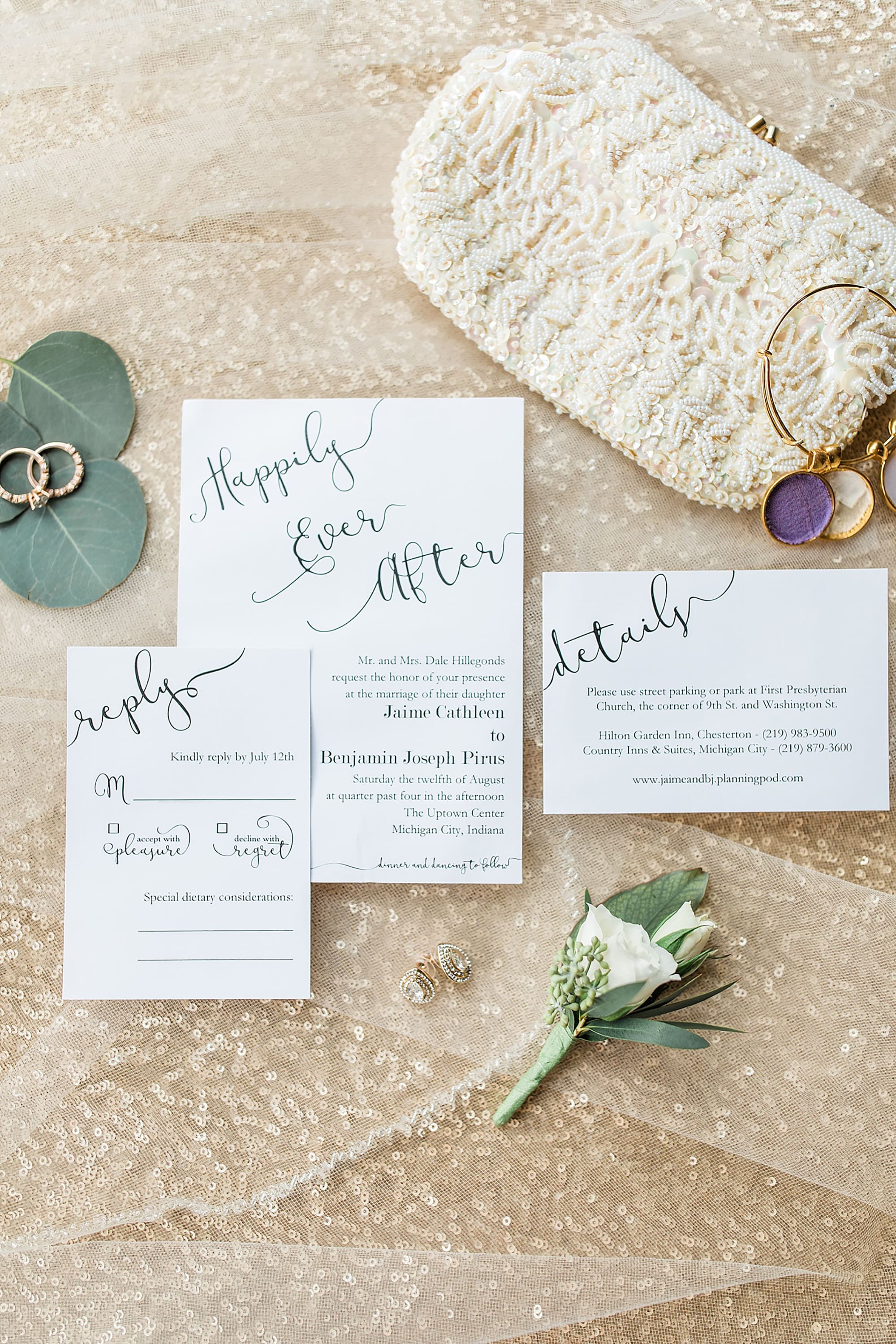 Arielle Peters Photography | Wedding invitation and jewelry on gold sequin background on wedding day at the Uptown Center in Michigan City, Indiana.