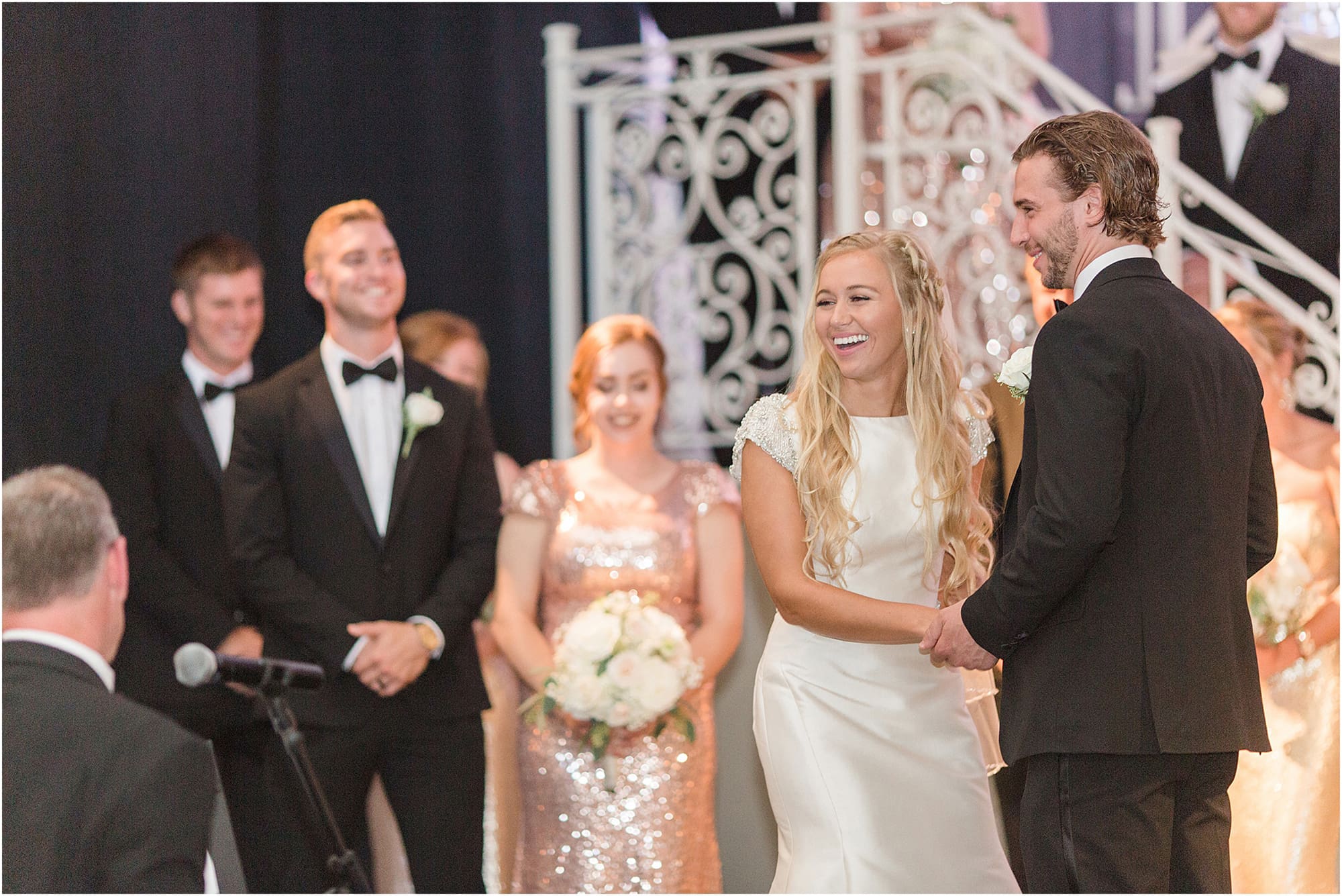 Arielle Peters Photography | Bride and groom laughing at the alter on wedding day at the Uptown Center in Michigan City, Indiana.