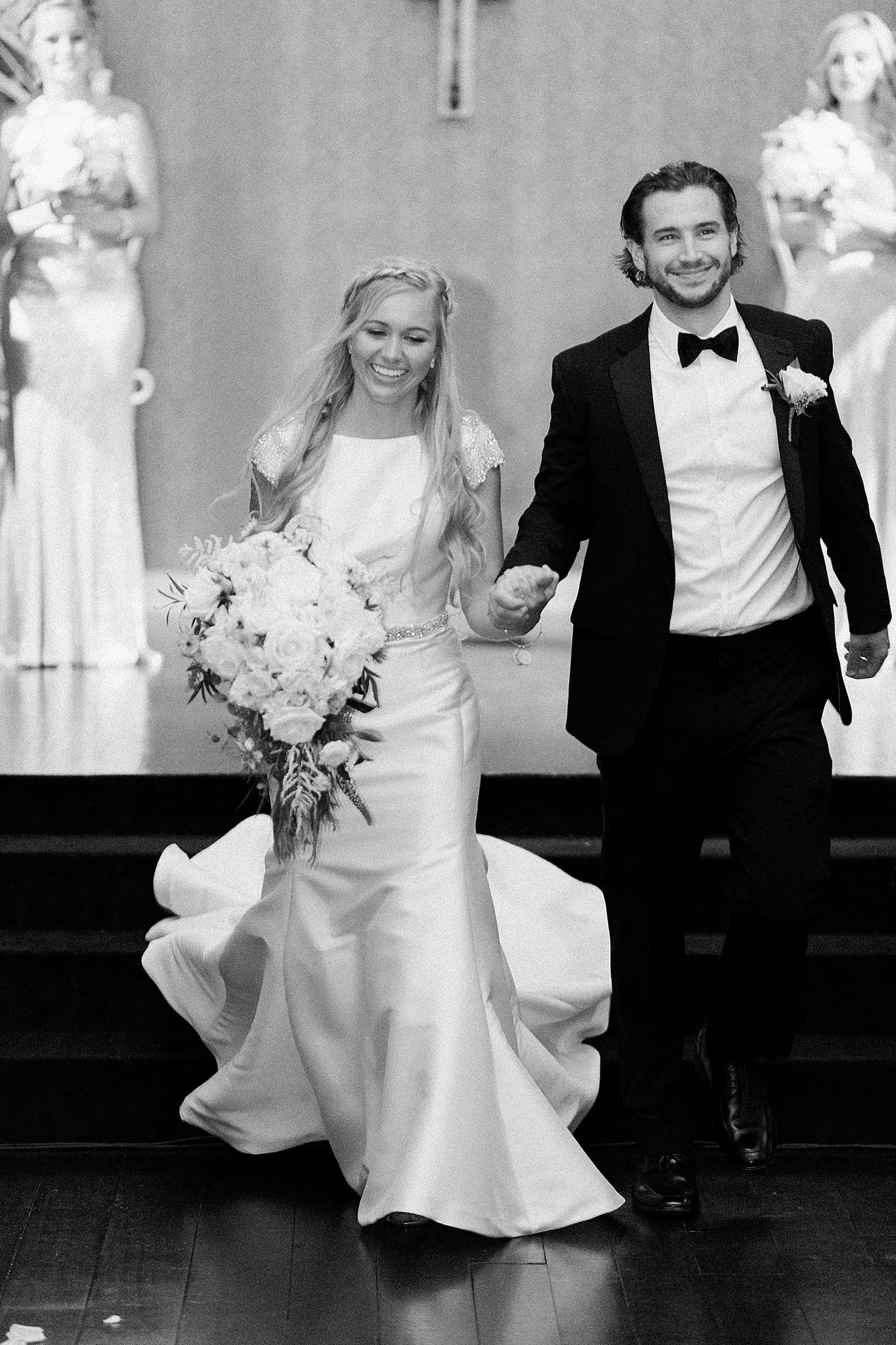 Arielle Peters Photography | Bride and groom walking down the aisle on wedding day at the Uptown Center in Michigan City, Indiana.