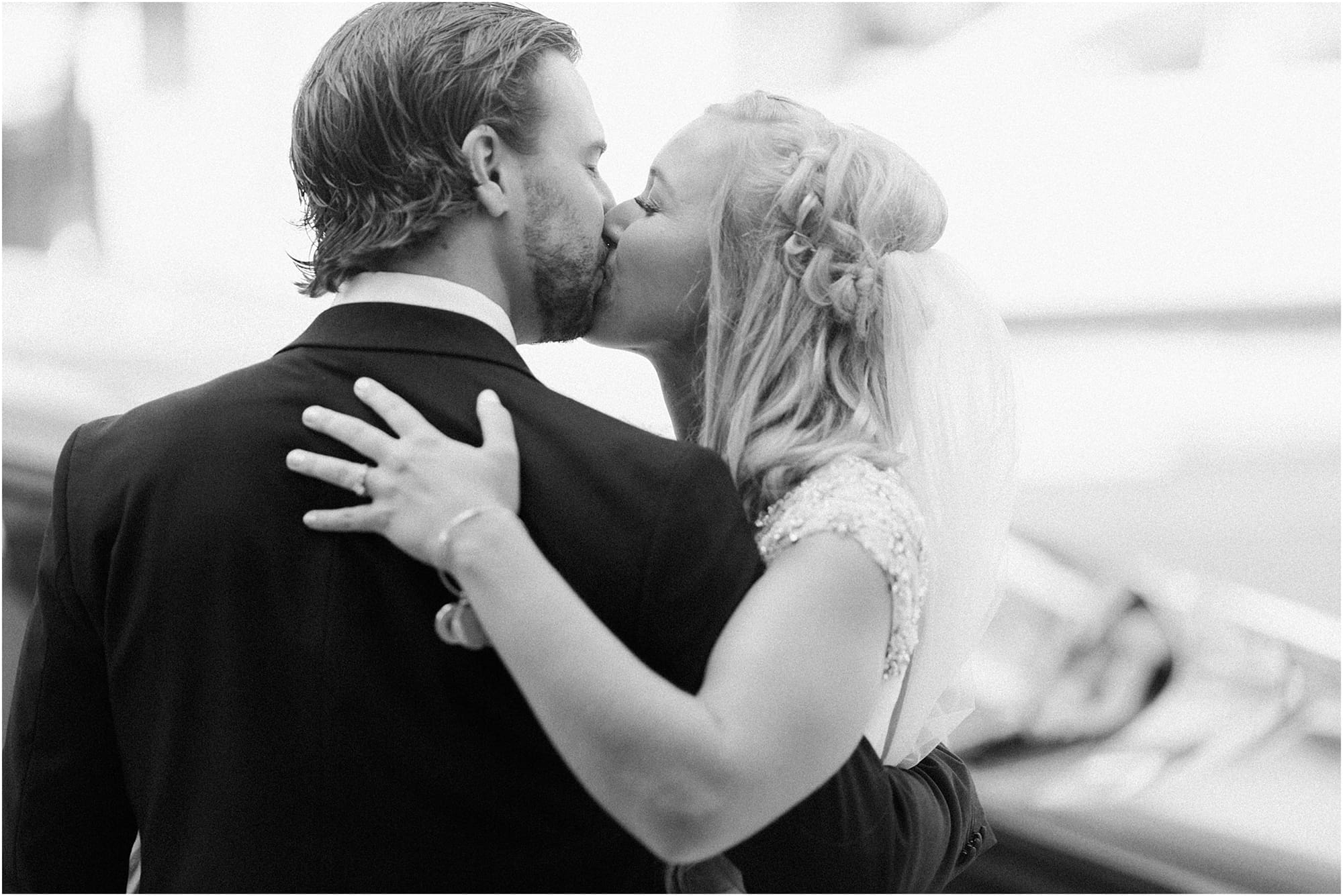 Arielle Peters Photography | Bride and groom kissing on wedding day at the Uptown Center in Michigan City, Indiana.