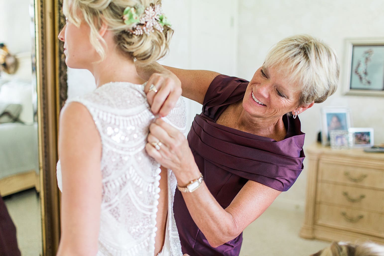 Arielle Peters Photography | Mother of bride helping bride get ready on wedding day at Joseph Decuis Farm in Roanoke, Indiana.