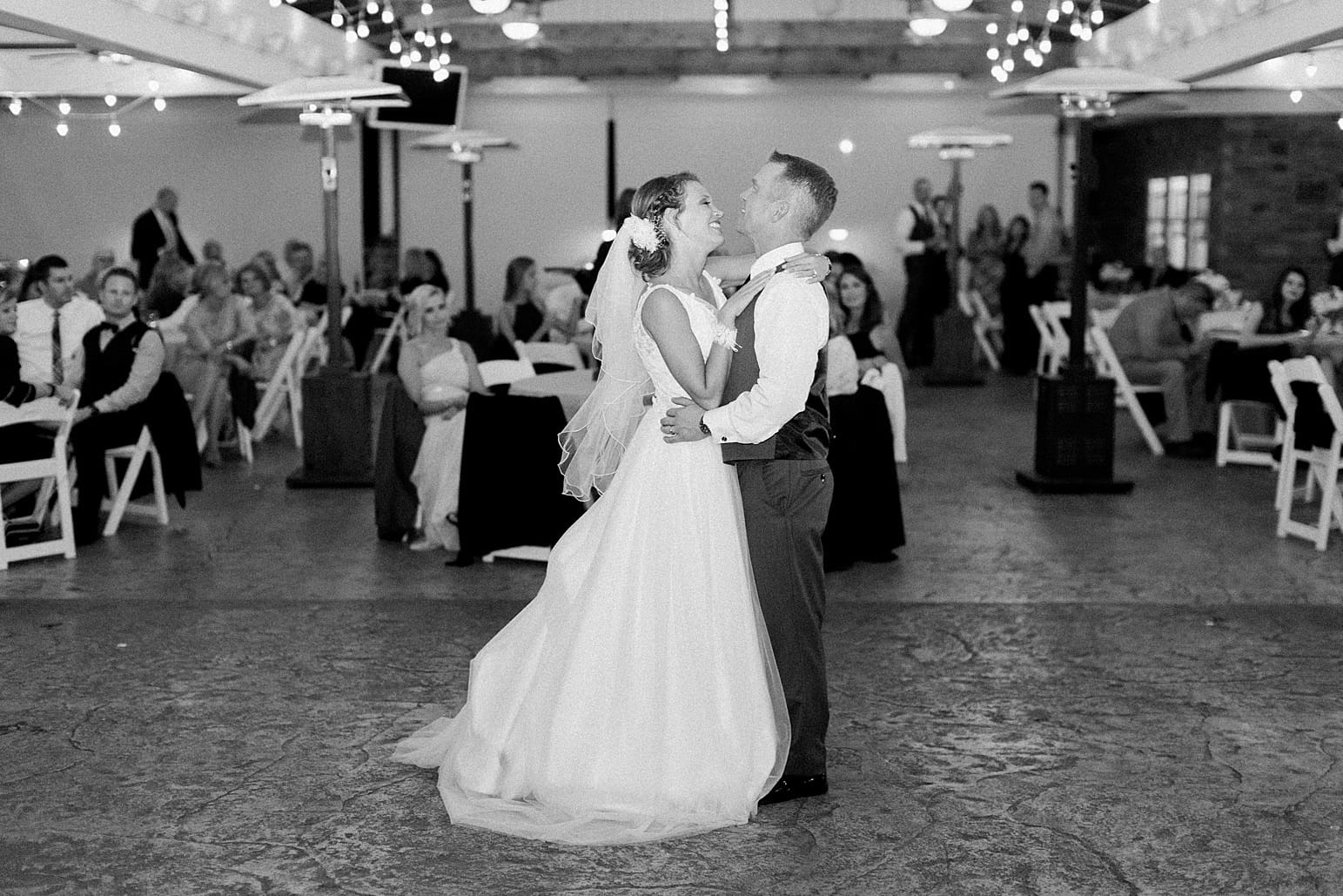 Arielle Peters Photography | Bride and groom sharing first dance at wedding reception on wedding day at The Pavilion at Sandy Pines in Demotte, Indiana.