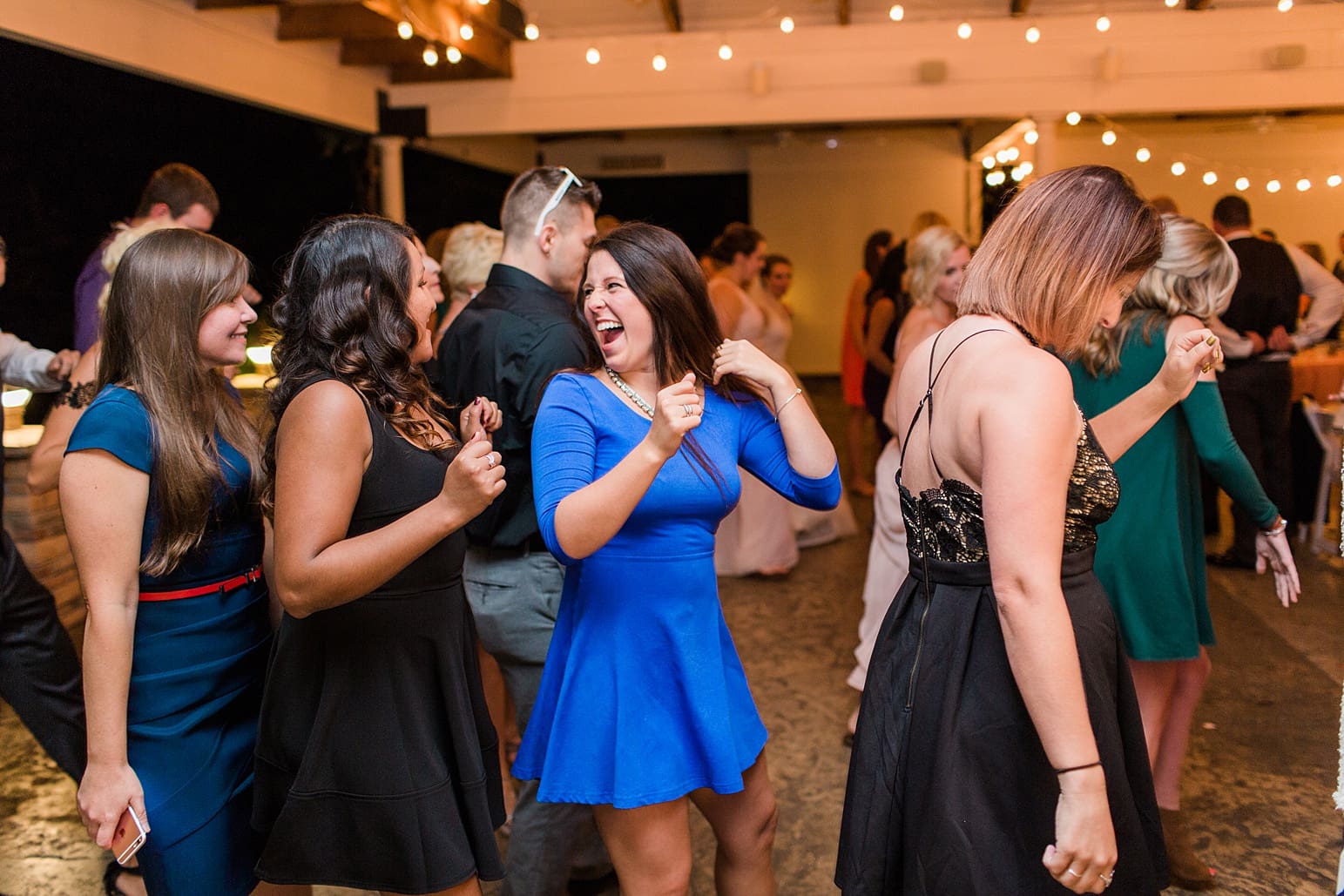 Arielle Peters Photography | Wedding guests dancing at wedding reception on wedding day at The Pavilion at Sandy Pines in Demotte, Indiana.