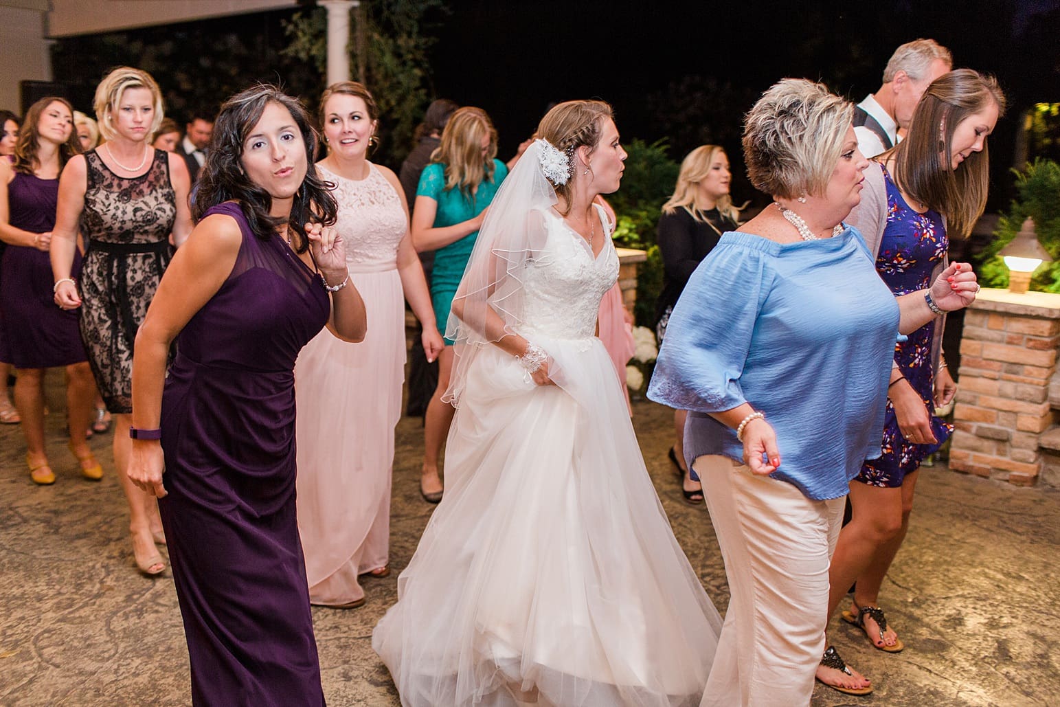 Arielle Peters Photography | Wedding guests dancing at wedding reception on wedding day at The Pavilion at Sandy Pines in Demotte, Indiana.
