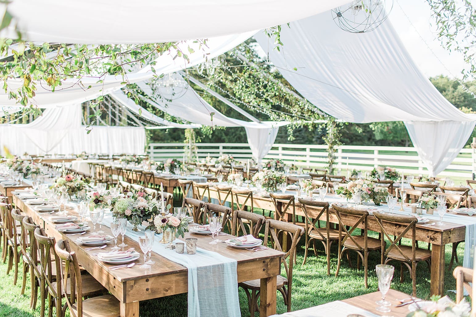 Arielle Peters Photography | Outdoor wedding reception table settings and floral arrangements on wedding day at Joseph Decuis Farm in Roanoke, Indiana.