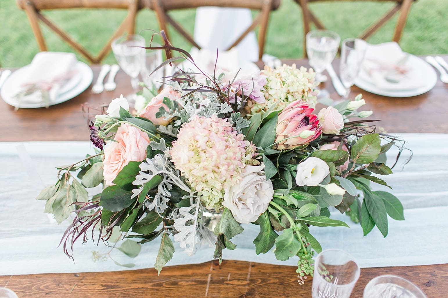 Arielle Peters Photography | Outdoor wedding reception table settings and floral arrangements on wedding day at Joseph Decuis Farm in Roanoke, Indiana.