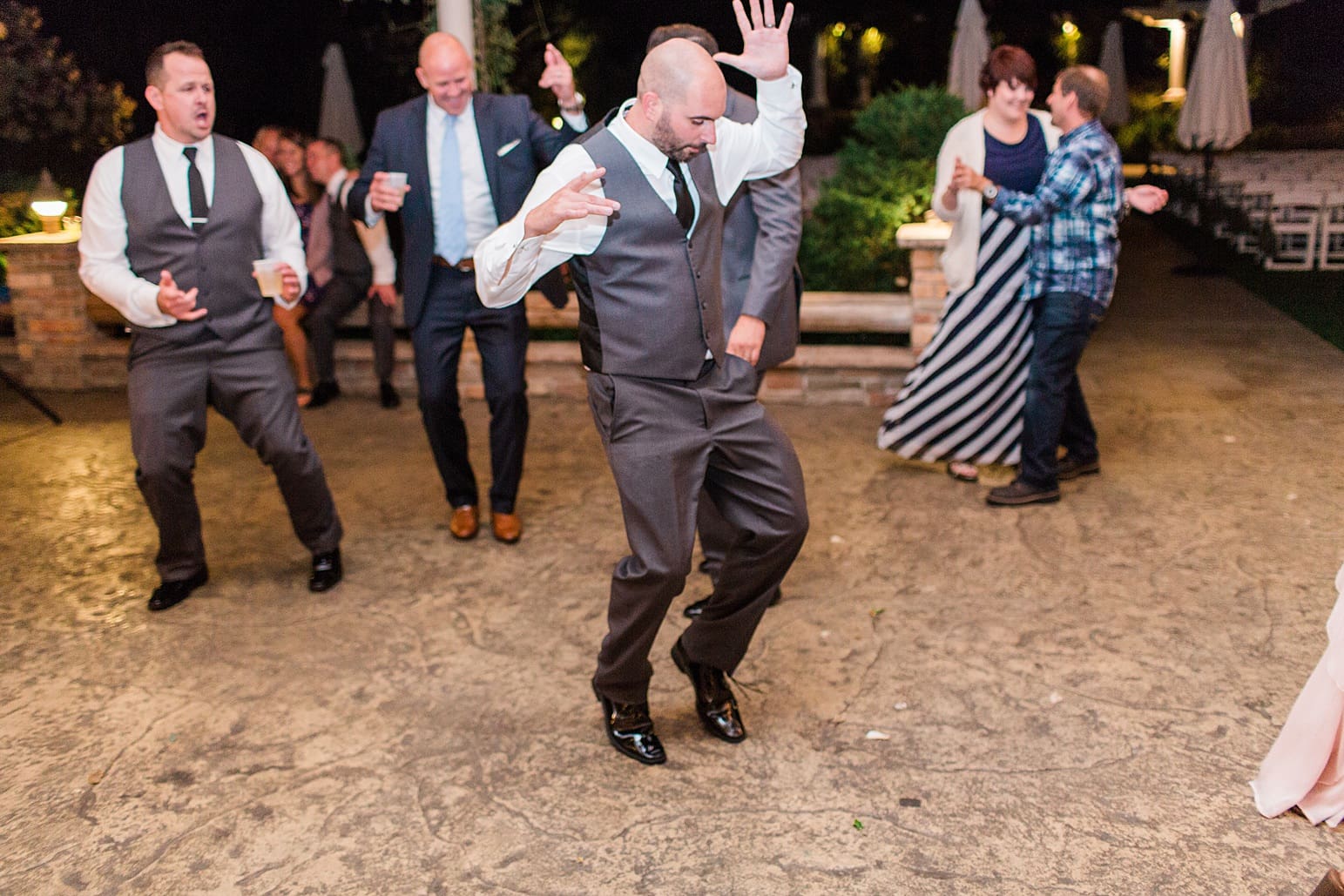 Arielle Peters Photography | Wedding guests dancing at wedding reception on wedding day at The Pavilion at Sandy Pines in Demotte, Indiana.