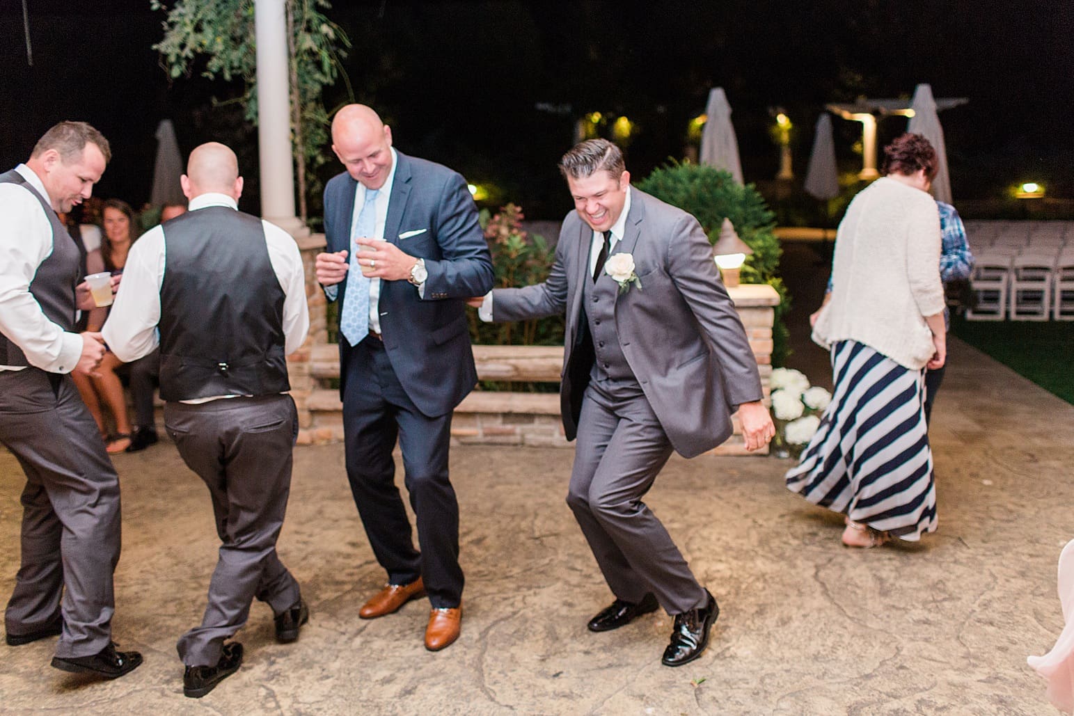 Arielle Peters Photography | Wedding guests dancing at wedding reception on wedding day at The Pavilion at Sandy Pines in Demotte, Indiana.