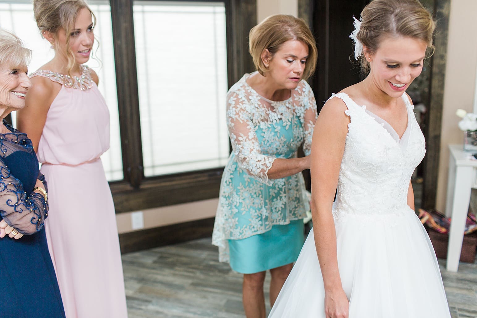 Arielle Peters Photography | Mother of bride helping bride get ready on wedding day at The Pavilion at Sandy Pines in Demotte, Indiana.