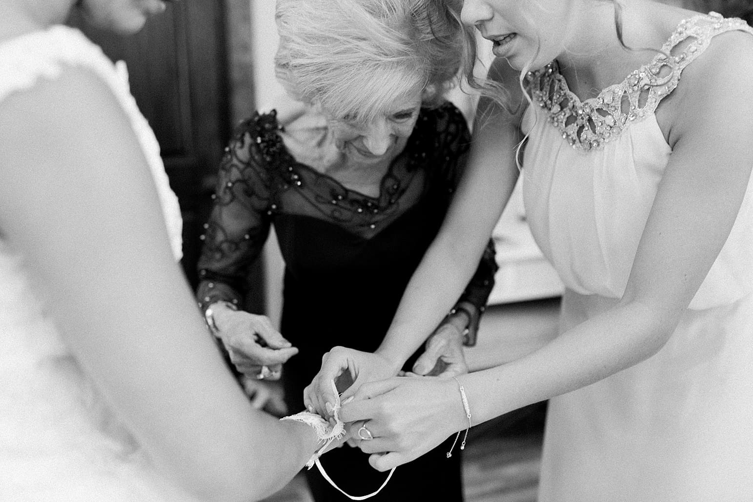 Arielle Peters Photography | Mother of bride helping bride get ready on wedding day at The Pavilion at Sandy Pines in Demotte, Indiana.