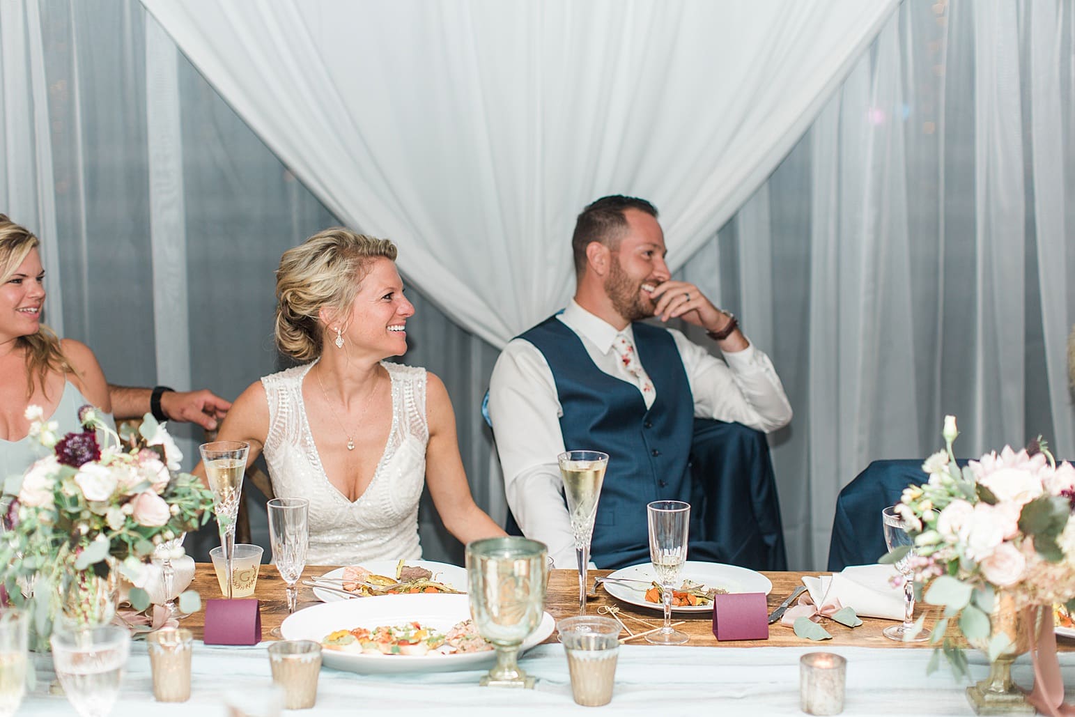 Arielle Peters Photography | Bride and groom laughing at outdoor wedding reception on wedding day at Joseph Decuis Farm in Roanoke, Indiana.
