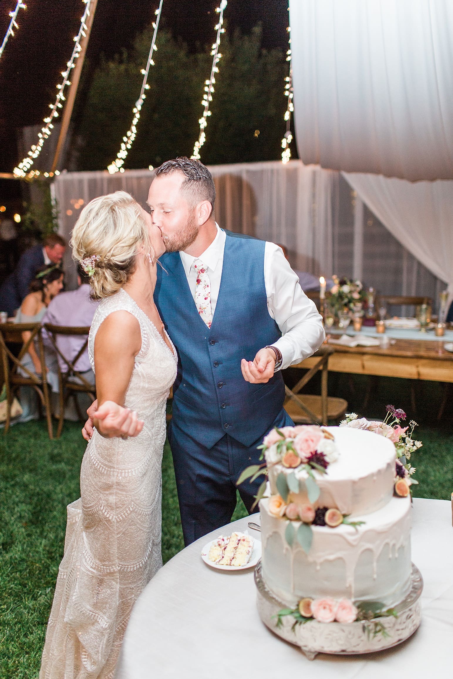 Arielle Peters Photography | Bride and groom kissing at outdoor wedding reception on wedding day at Joseph Decuis Farm in Roanoke, Indiana.