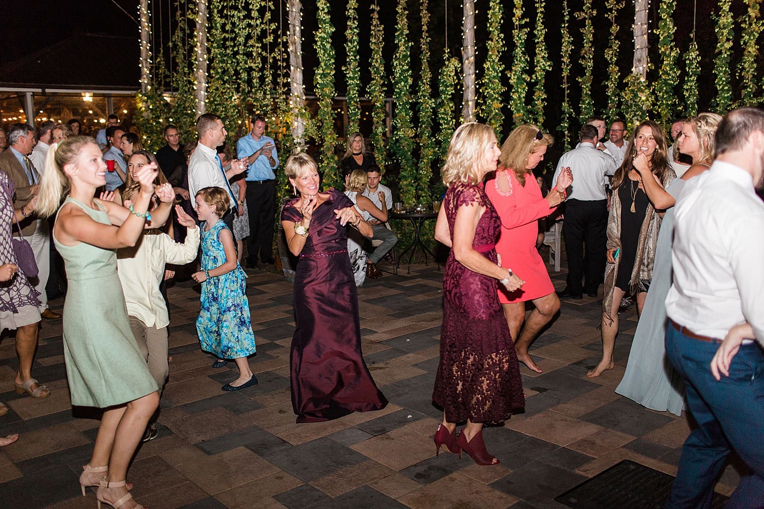 Arielle Peters Photography | Wedding guests dancing at outdoor wedding reception on wedding day at Joseph Decuis Farm in Roanoke, Indiana.