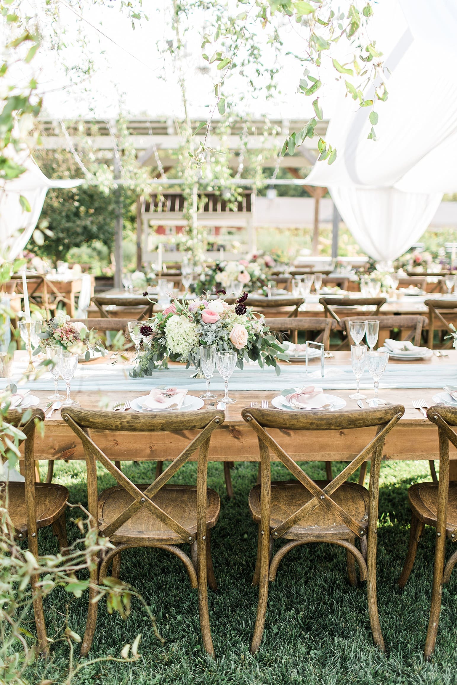 Arielle Peters Photography | Outdoor wedding reception table settings and floral arrangements on wedding day at Joseph Decuis Farm in Roanoke, Indiana.