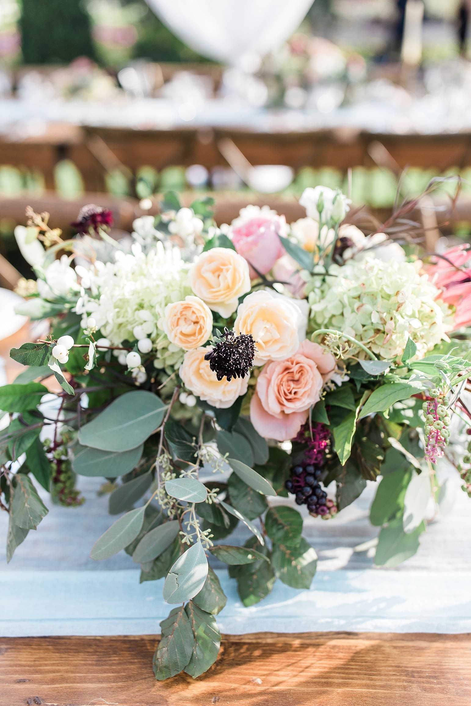 Arielle Peters Photography | Outdoor wedding reception table settings and floral arrangements on wedding day at Joseph Decuis Farm in Roanoke, Indiana.