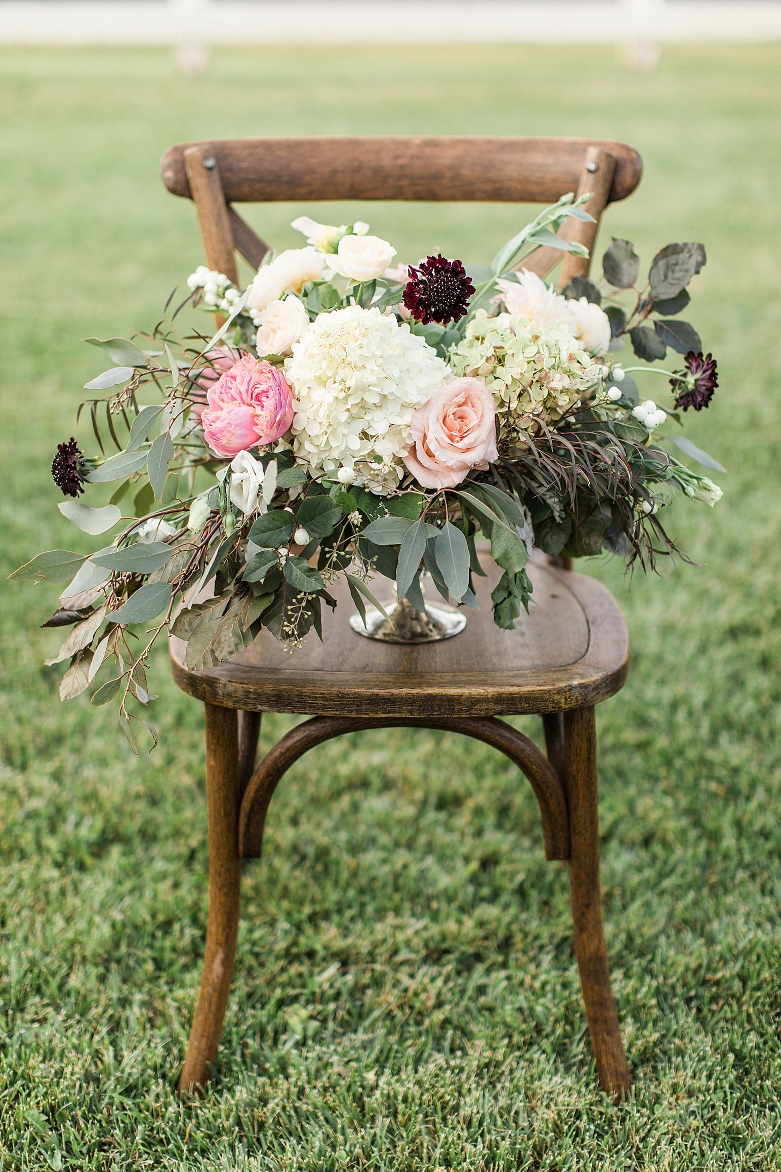 Arielle Peters Photography | Outdoor wedding reception table settings and floral arrangements on wedding day at Joseph Decuis Farm in Roanoke, Indiana.