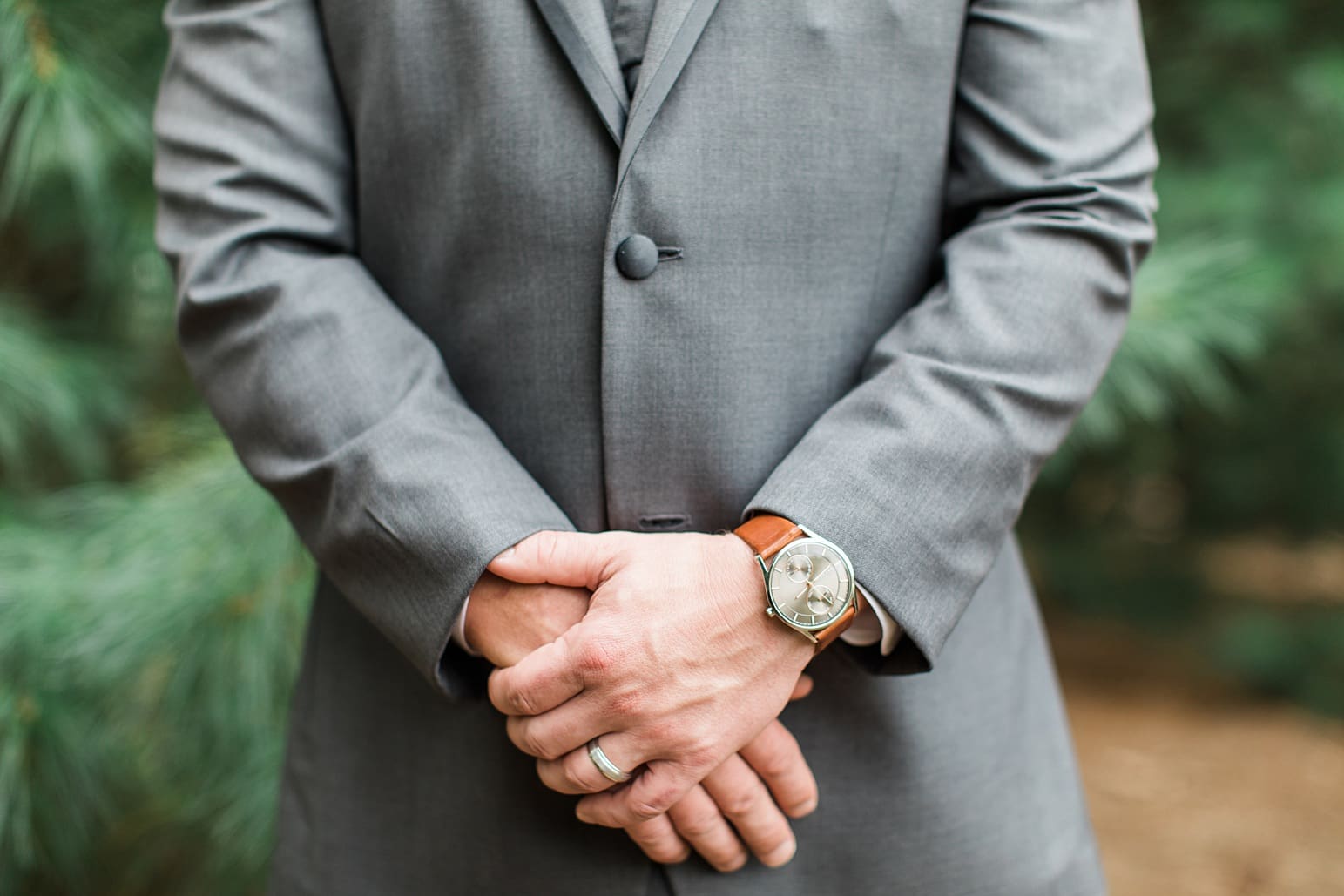 Arielle Peters Photography | Groom standing by tall pine trees on wedding day at The Pavilion at Sandy Pines in Demotte, Indiana.