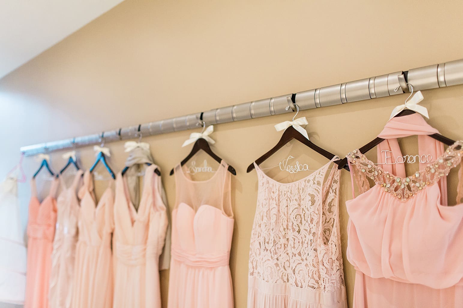 Arielle Peters Photography | Bridesmaids dresses hanging up on wedding day at The Pavilion at Sandy Pines in Demotte, Indiana.