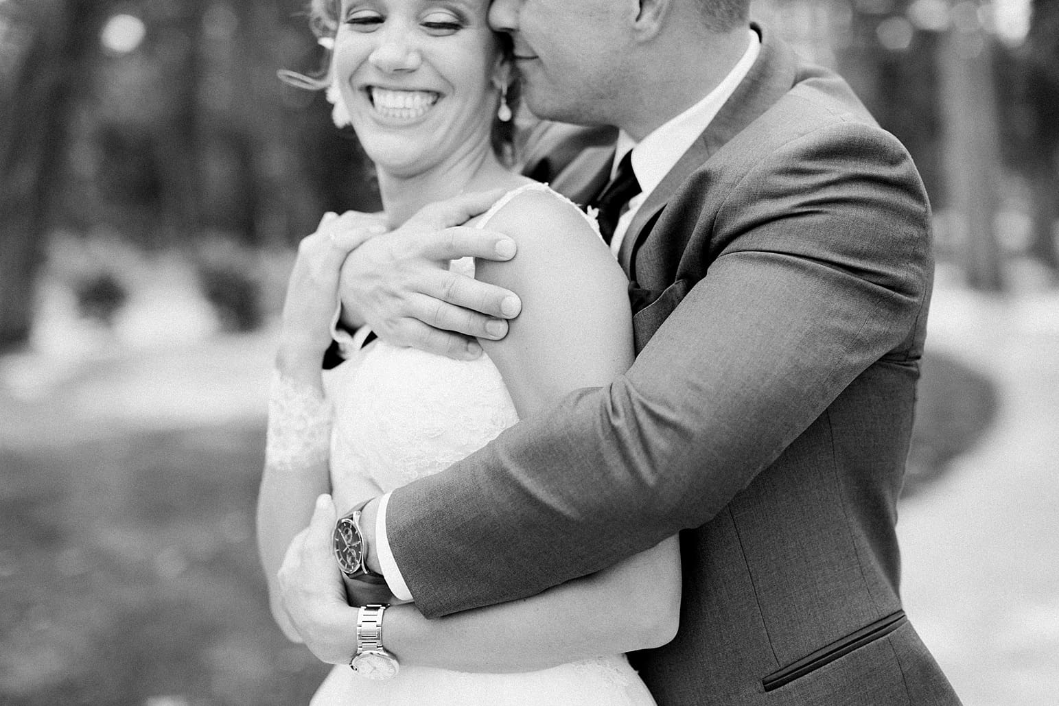Arielle Peters Photography | Bride and groom hugging in pine tree forest on wedding day at The Pavilion at Sandy Pines in Demotte, Indiana.