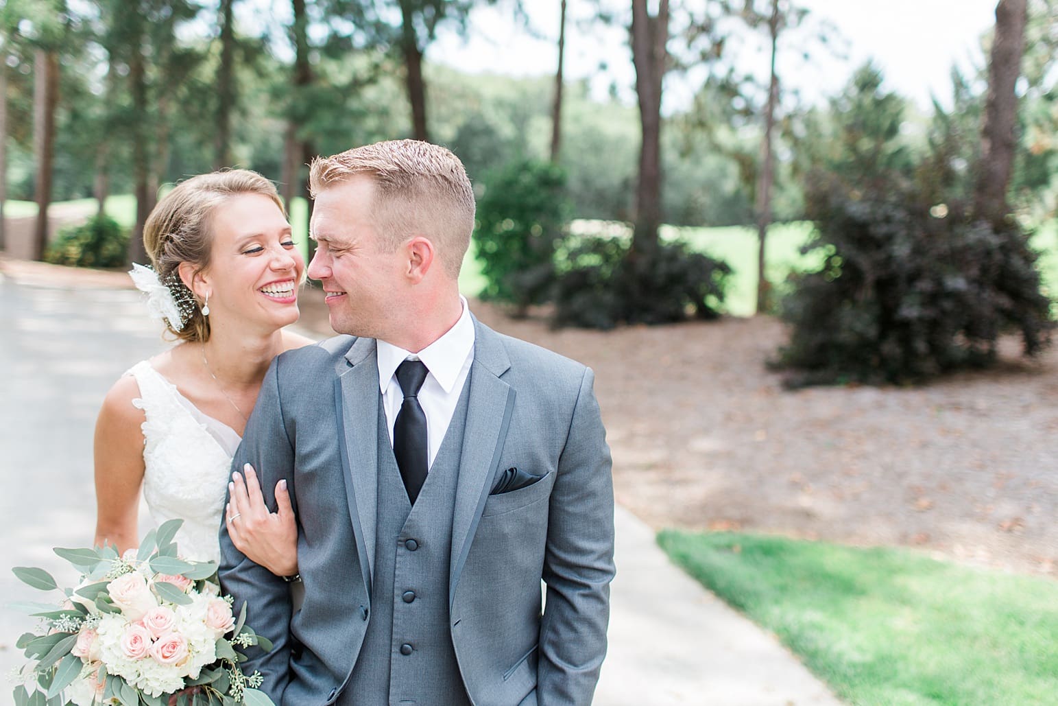 Arielle Peters Photography | Bride and groom walking in pine tree forest on wedding day at The Pavilion at Sandy Pines in Demotte, Indiana.