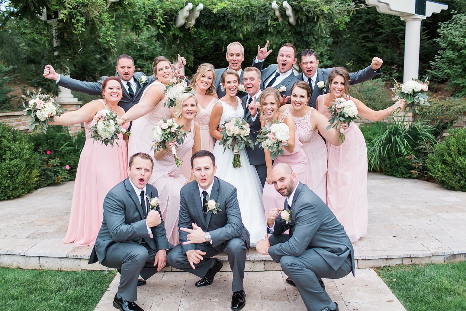 Arielle Peters Photography | Wedding party cheering by pavilion on wedding day at The Pavilion at Sandy Pines in Demotte, Indiana.