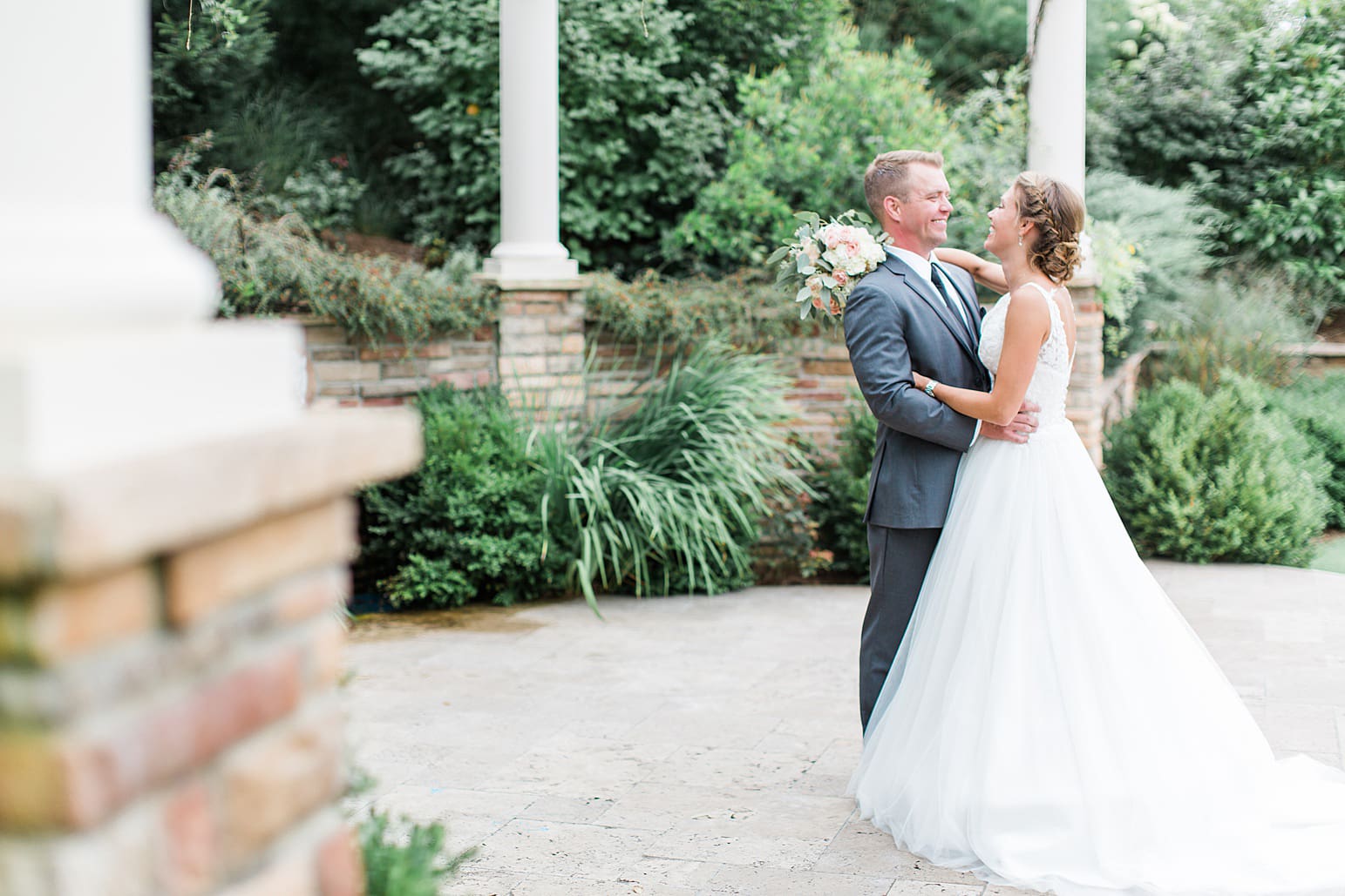 Arielle Peters Photography | Bride and groom under pavilion on wedding day at The Pavilion at Sandy Pines in Demotte, Indiana.