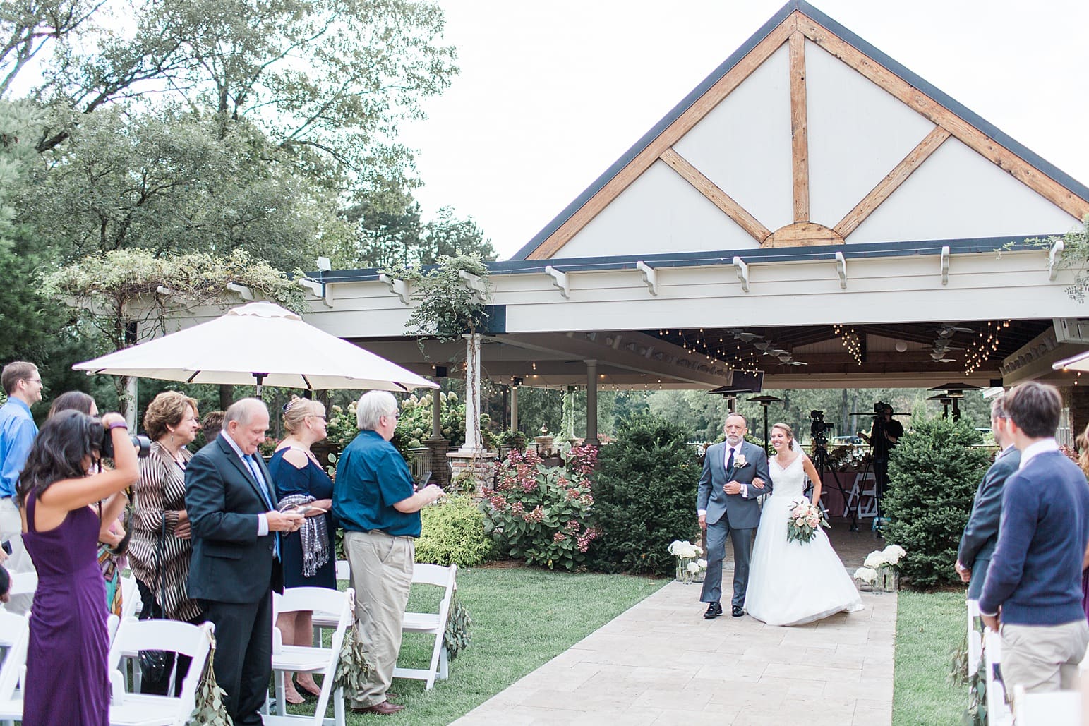 Arielle Peters Photography | Father of bride walking bride down the aisle on wedding day at The Pavilion at Sandy Pines in Demotte, Indiana.