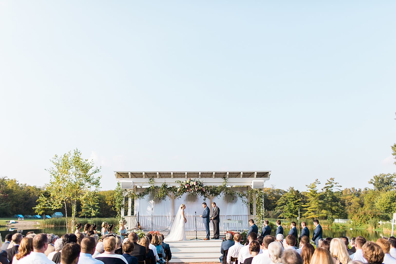 Arielle Peters Photography | Bride and groom at alter at outdoor wedding ceremony at Joseph Decuis Farm in Roanoke, Indiana.