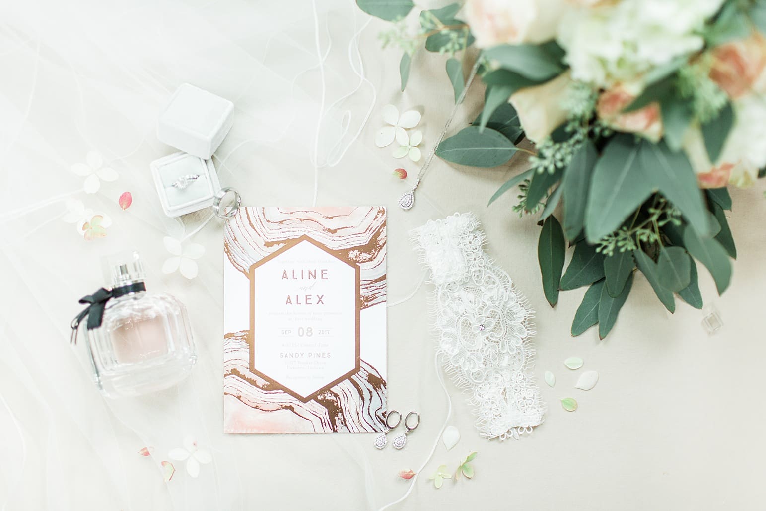 Arielle Peters Photography | Wedding invitation and floral arrangements on wedding day at The Pavilion at Sandy Pines in Demotte, Indiana.