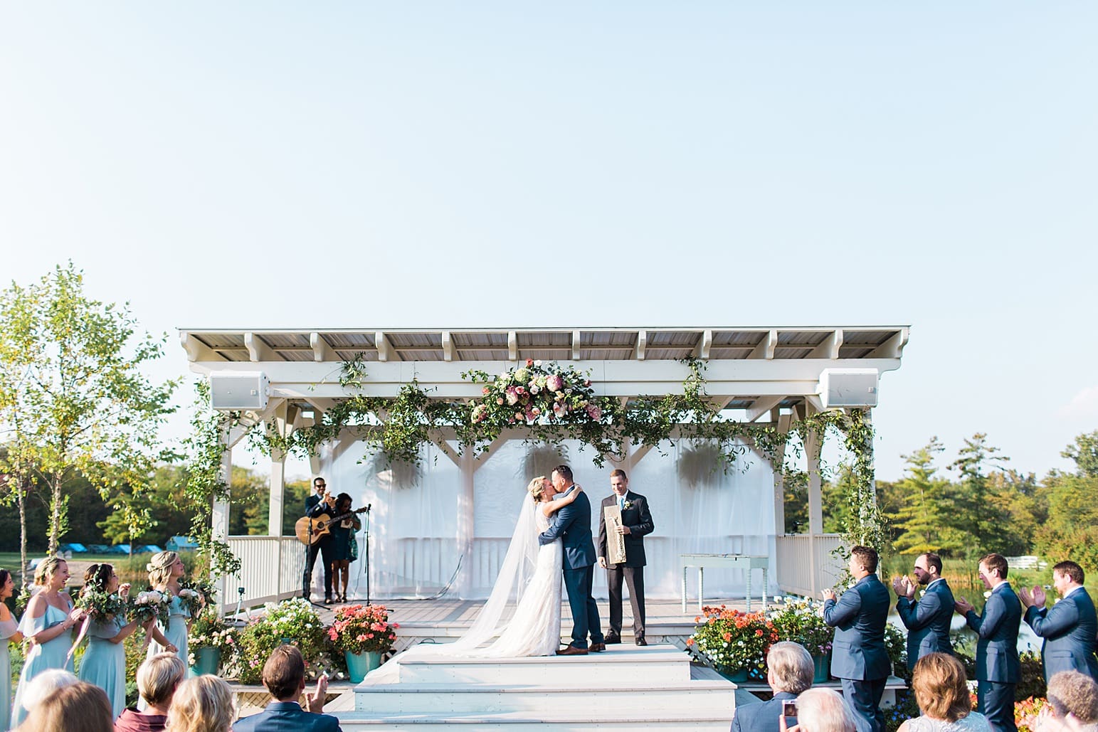 Arielle Peters Photography | Bride and groom kissing at alter at outdoor wedding ceremony at Joseph Decuis Farm in Roanoke, Indiana.