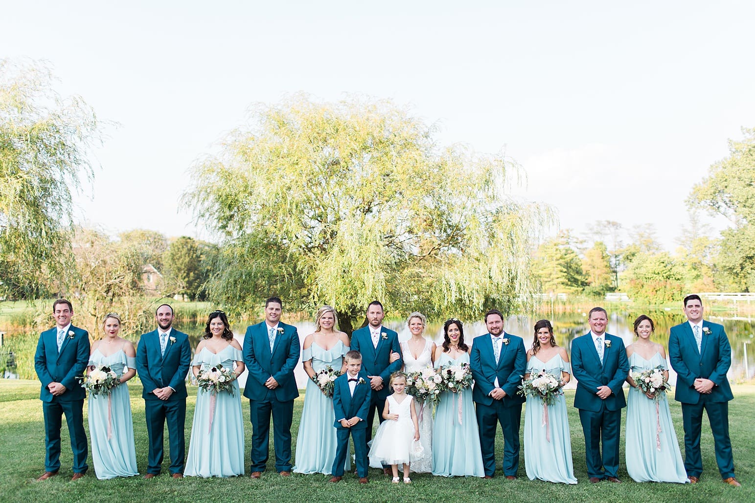 Arielle Peters Photography | Wedding party standing next to pond and willow tree on wedding day at Joseph Decuis Farm in Roanoke, Indiana.