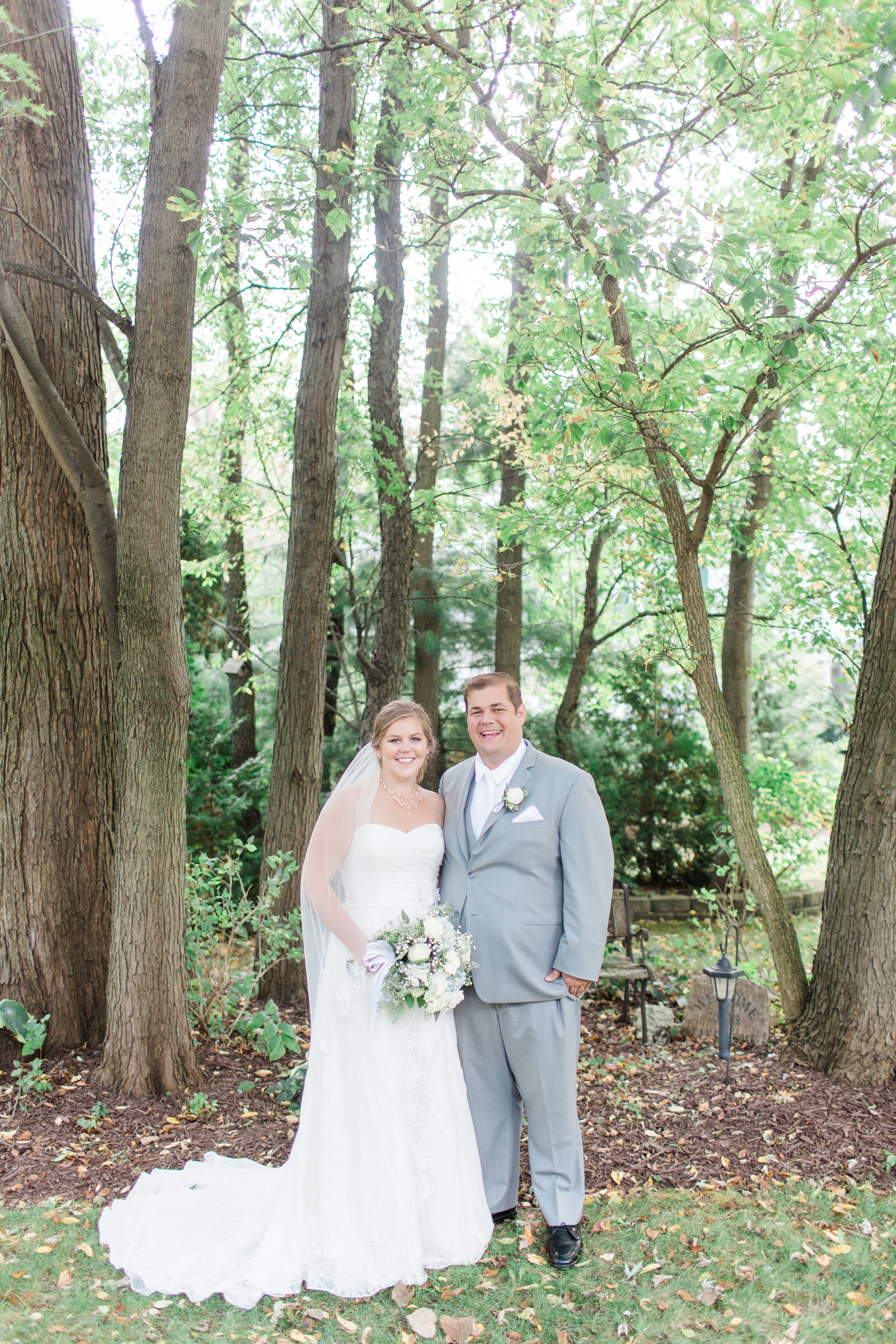 Arielle Peters Photography taking a couple’s wedding day photos at the Sleepy Owl Restaurant in Syracuse, Indiana.