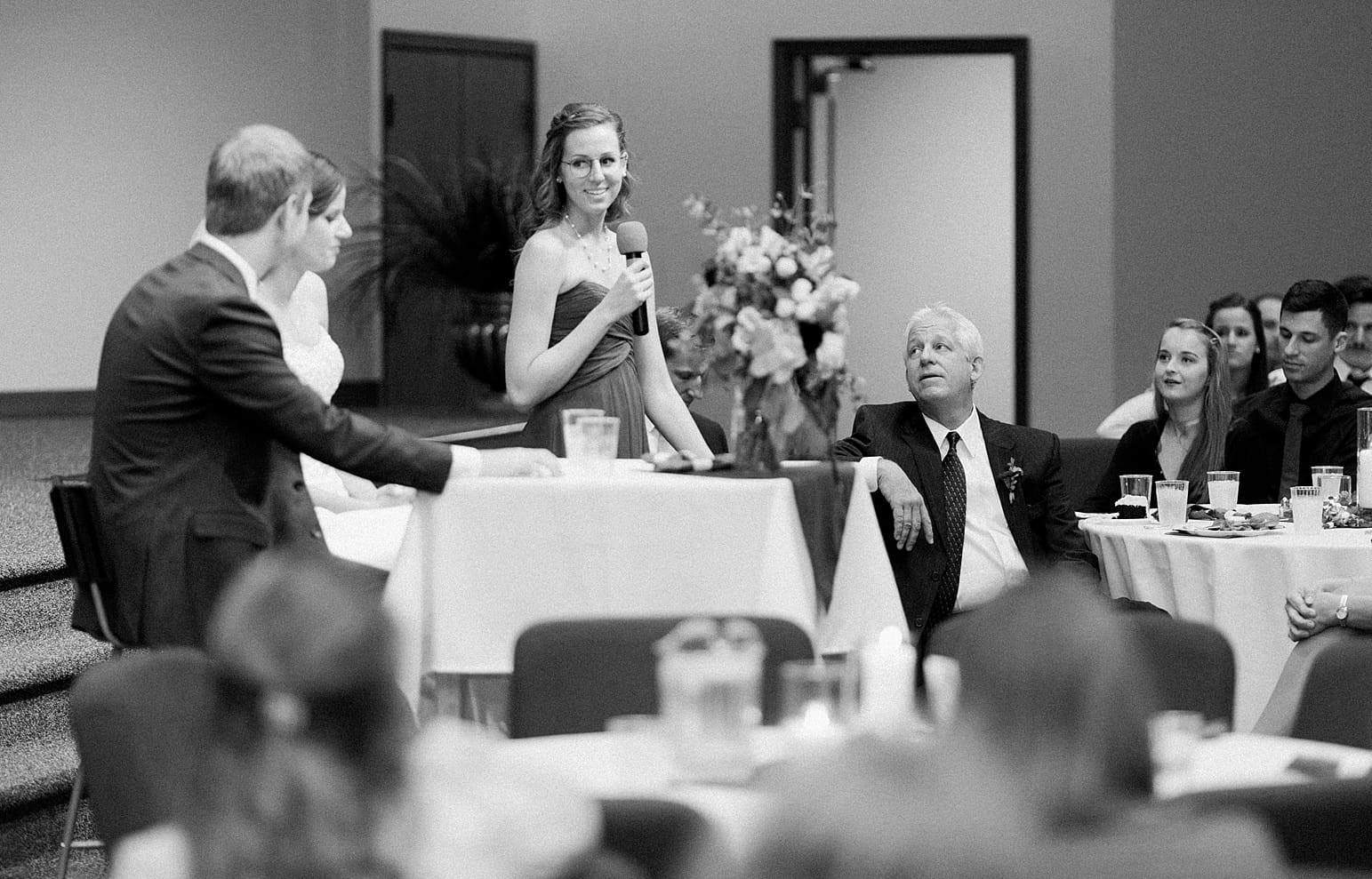 Arielle Peters Photography | Maid of honor giving speech at wedding reception on fall wedding day in Winona Lake, Indiana.