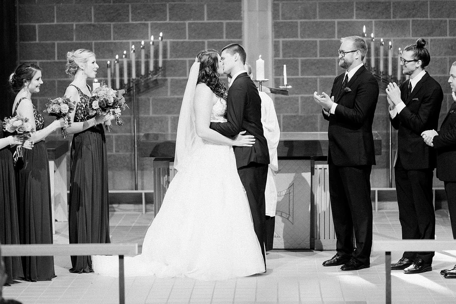 Arielle Peters Photography | Bride and groom kissing at the alter on wedding day in Carmel, Indiana. 