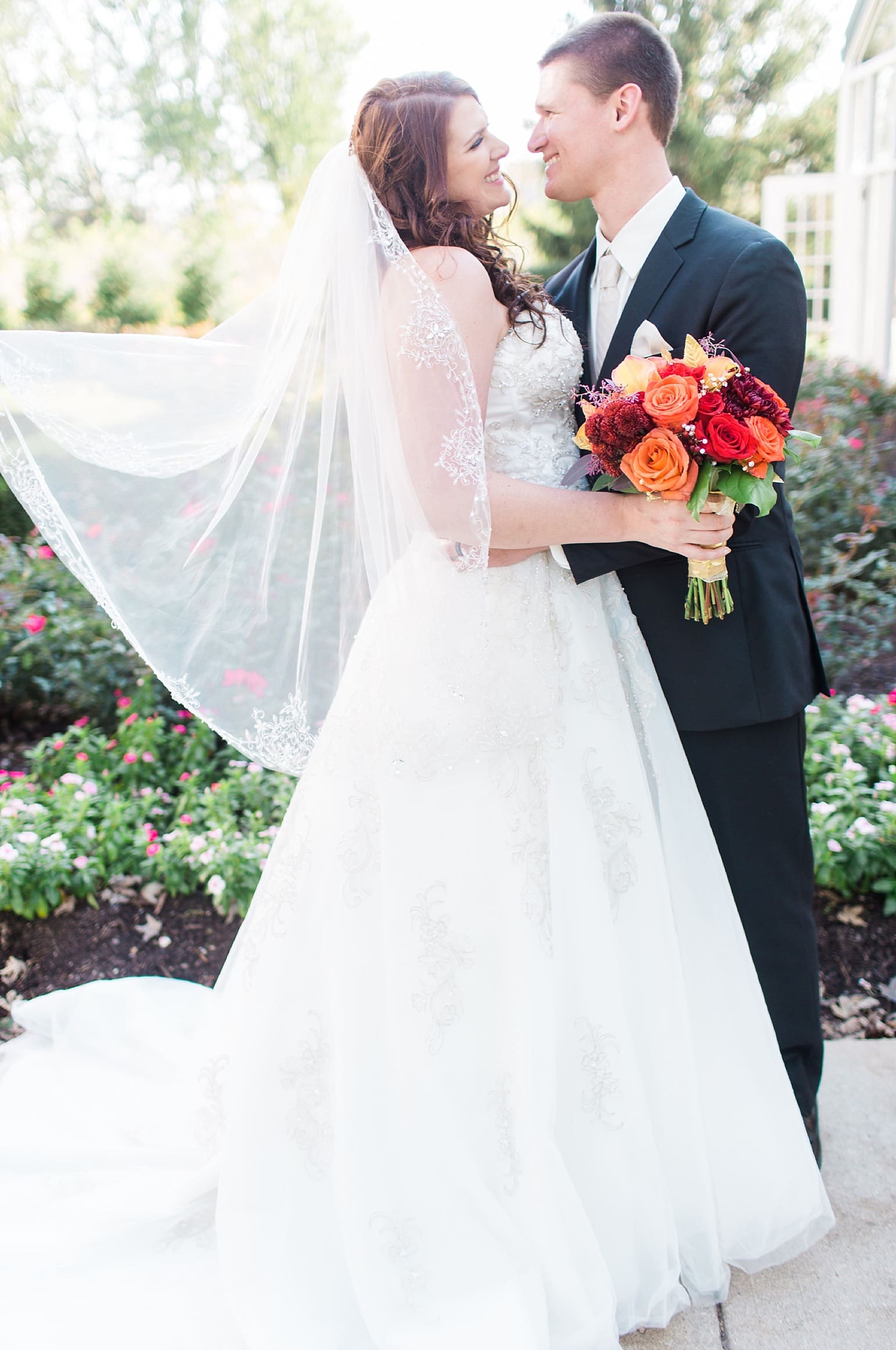 Arielle Peters Photography | Bride and groom in courtyard outside on wedding day at the Ritz Charles Garden Pavilion in Carmel, Indiana. 
