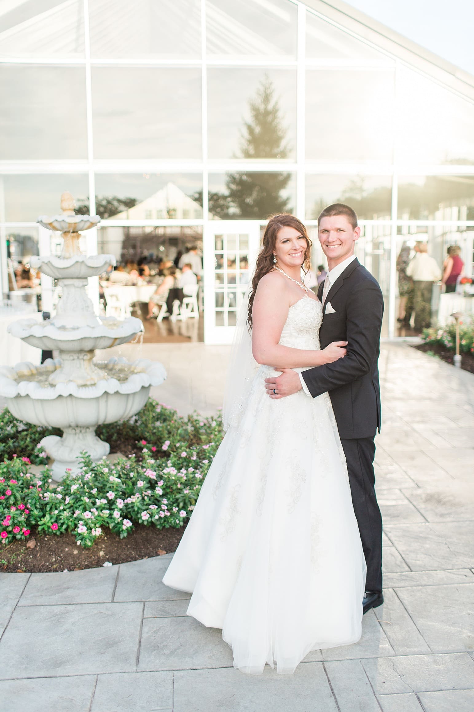 Arielle Peters Photography | Bride and groom in courtyard outside on wedding day at the Ritz Charles Garden Pavilion in Carmel, Indiana. 