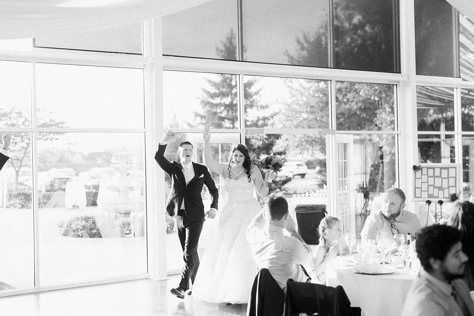 Arielle Peters Photography | Bride and groom entering wedding reception on wedding day at the Ritz Charles Garden Pavilion in Carmel, Indiana. 