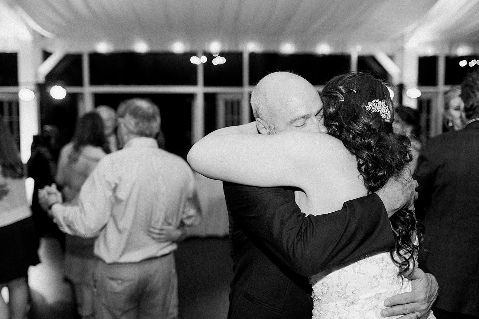 Arielle Peters Photography | Father of bride and bride hugging at wedding reception on wedding day at the Ritz Charles Garden Pavilion in Carmel, Indiana. 