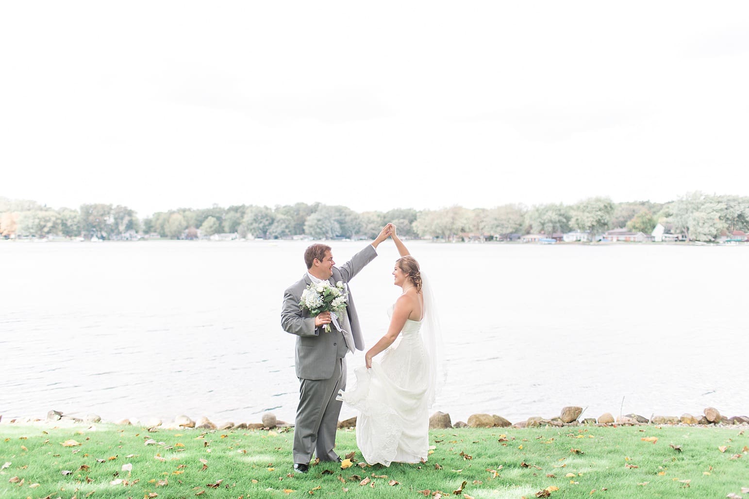Arielle Peters Photography taking a couple’s wedding day photos at the Sleepy Owl Restaurant in Syracuse, Indiana.