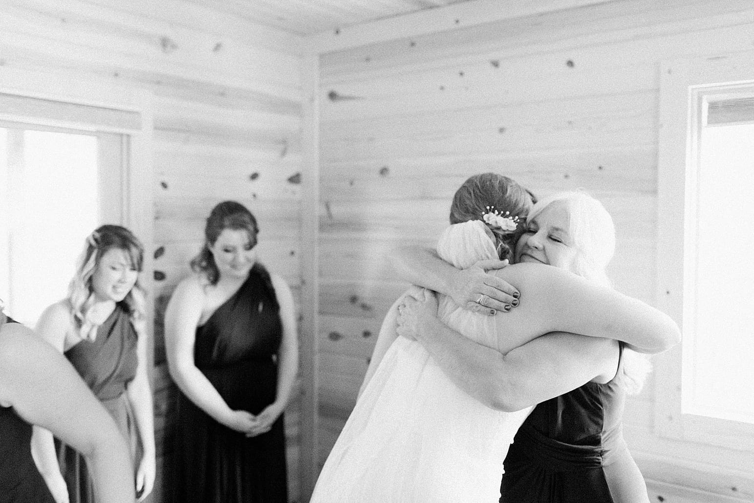 Arielle Peters Photography | Mother of bride and bride hugging on wedding day in Syracuse, Indiana.