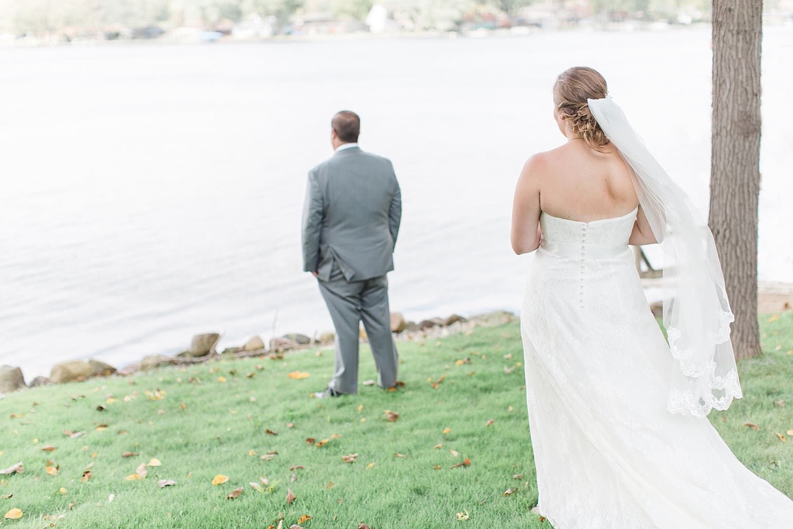 Arielle Peters Photography | Bride and groom having first reveal by lake on wedding day in Syracuse, Indiana.