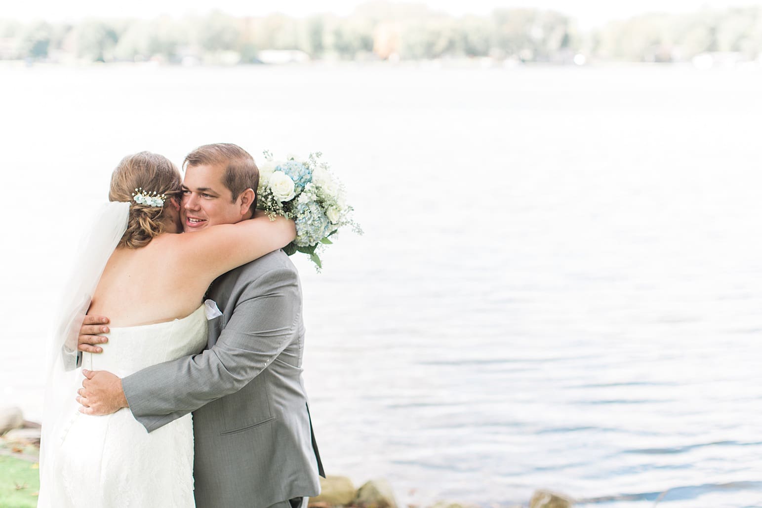 Arielle Peters Photography | Bride and groom having first reveal by lake on wedding day in Syracuse, Indiana.