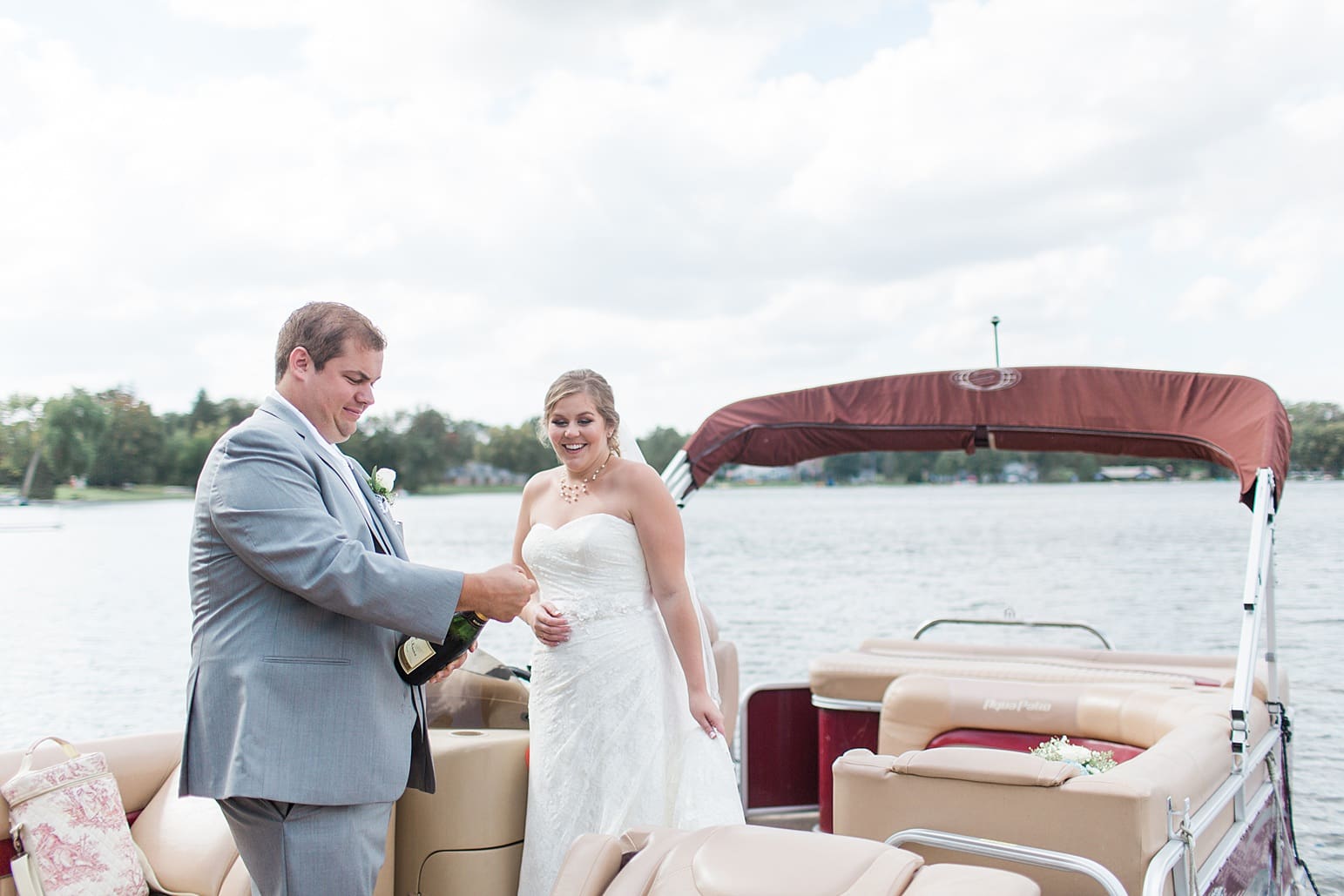 Arielle Peters Photography | Bride and groom on boat on lake on wedding day in Syracuse, Indiana.