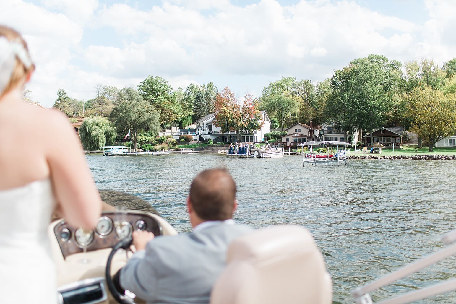 Arielle Peters Photography | Bride and groom on boat on lake on wedding day in Syracuse, Indiana.
