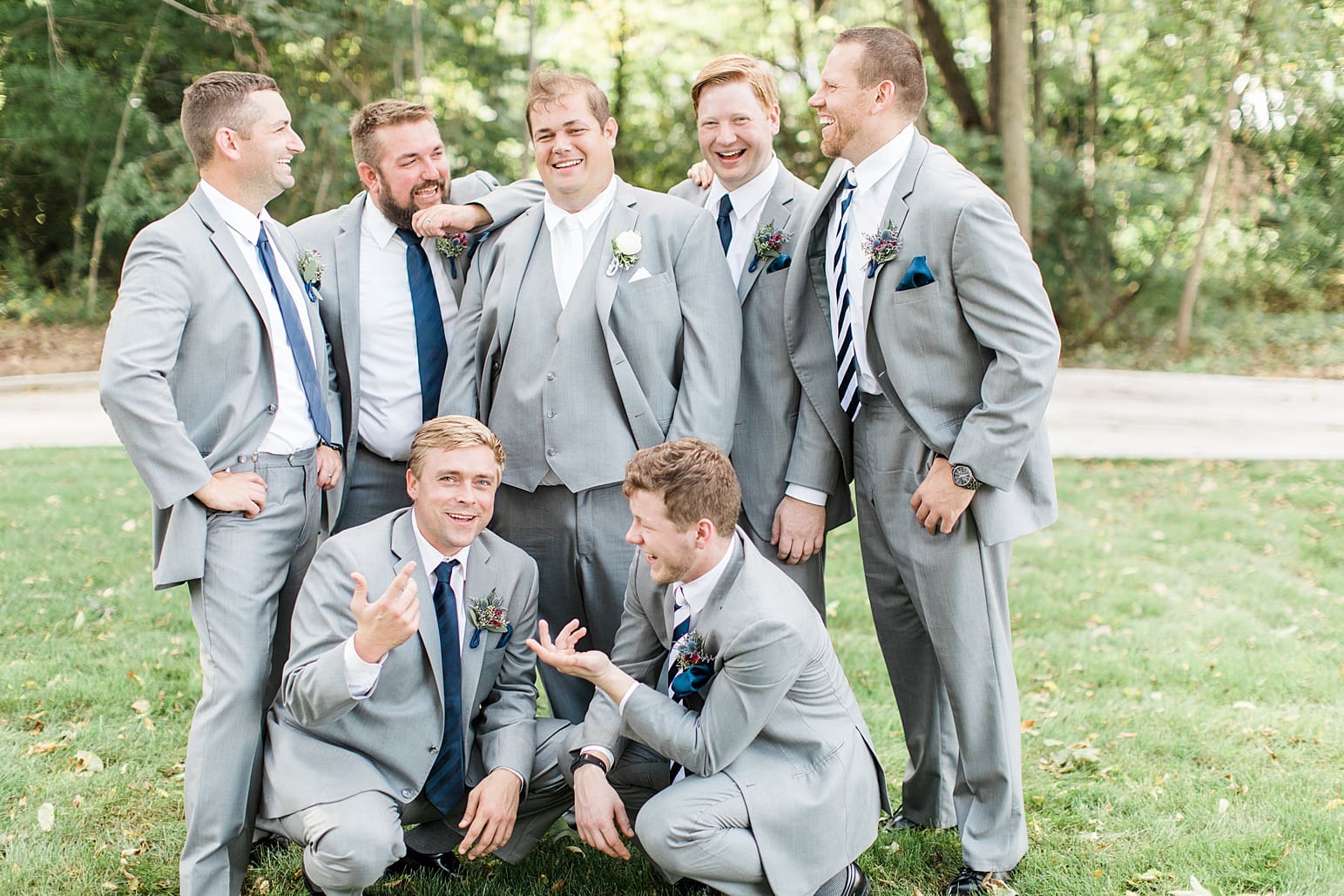 Arielle Peters Photography | Groom and groomsmen outside under trees on wedding day in Syracuse, Indiana.