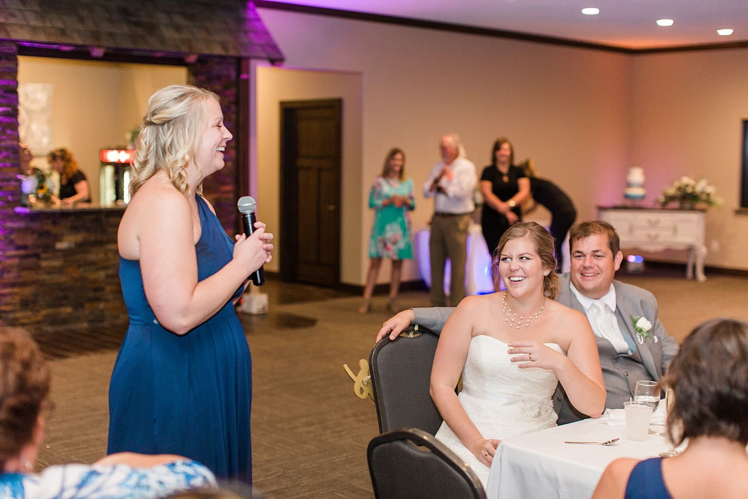 Arielle Peters Photography | Maid of honor giving speech at wedding reception on wedding day at Sleepy Owl Restaurant in Syracuse, Indiana.