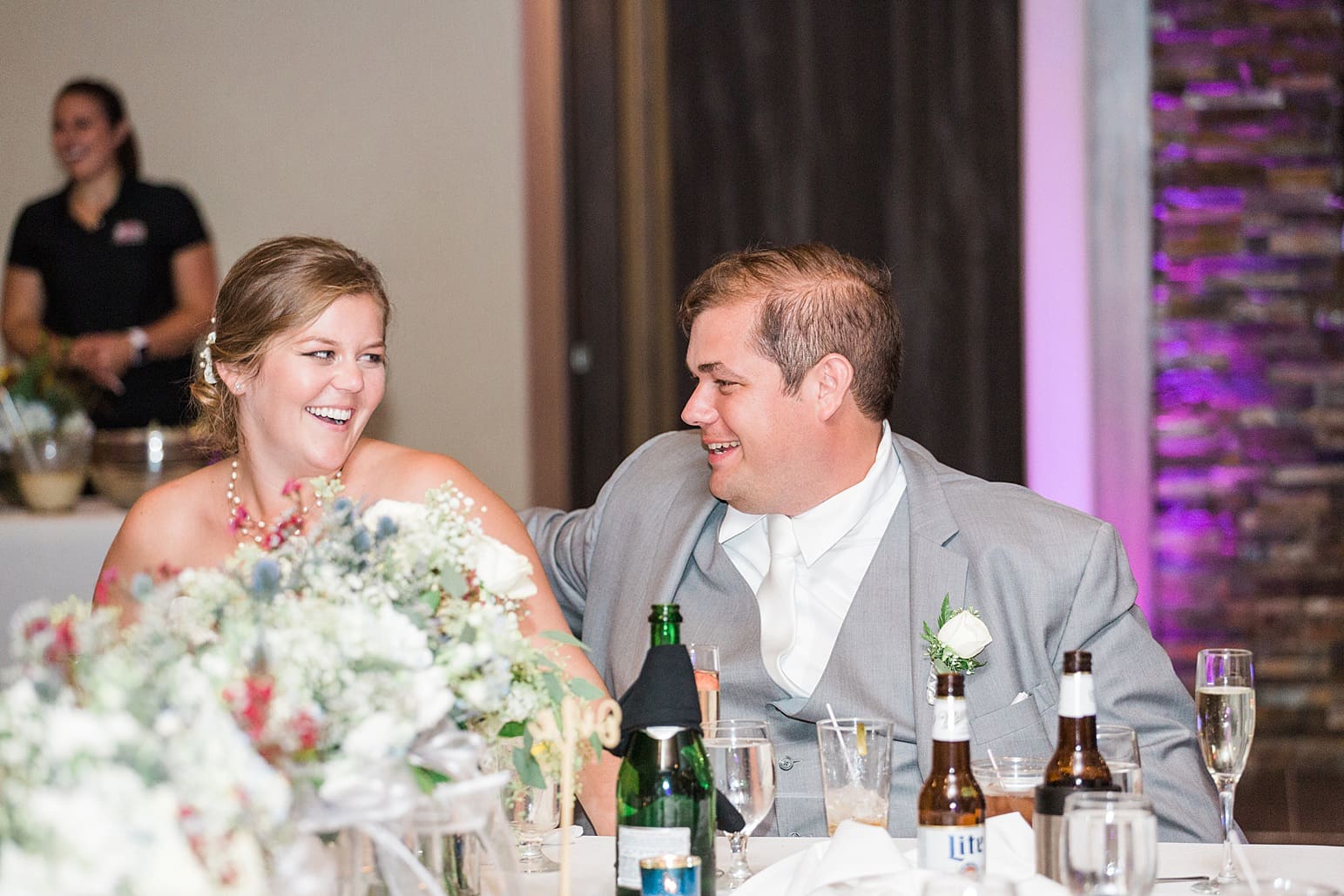 Arielle Peters Photography | Bride and groom laughing at wedding reception on wedding day at Sleepy Owl Restaurant in Syracuse, Indiana.
